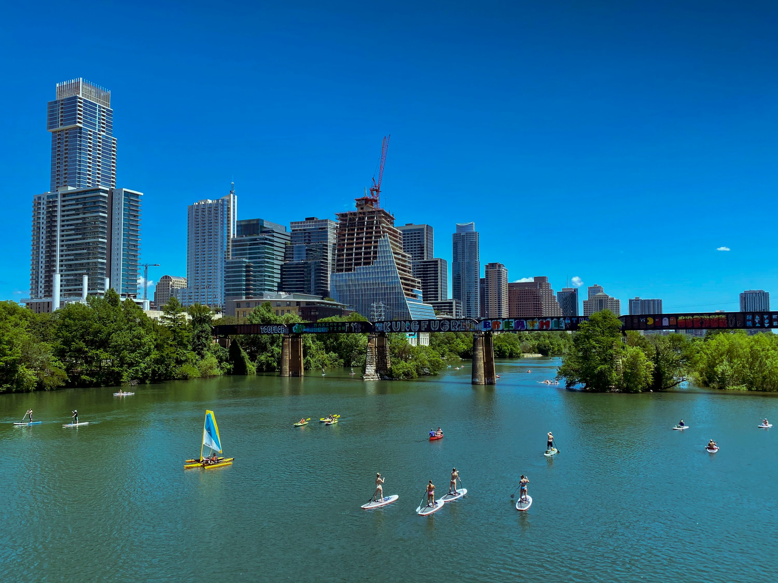 Austin skyline and people enjoying Lady Bird Lake